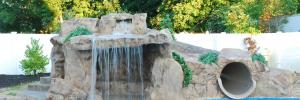 a waterslide with a waterfall