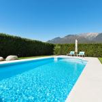 Modern villa with pool, view from the garden