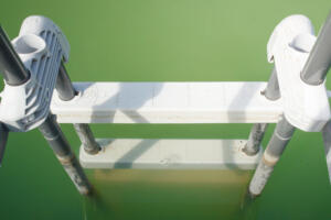 Above ground pool with a problem of green algae (chlorophyta) in the water. stock photo