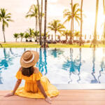 young woman sitting by pool