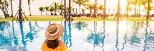 young woman sitting by pool