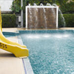 Swimming pool and Silder around in hotel resort.