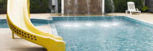 Swimming pool and Silder around in hotel resort.