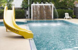 Swimming pool and Silder around in hotel resort.