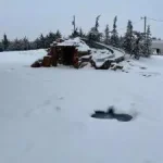 pool and pool slide covered in snow during the winter