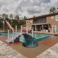 Resort pool with water slide and footbridge
